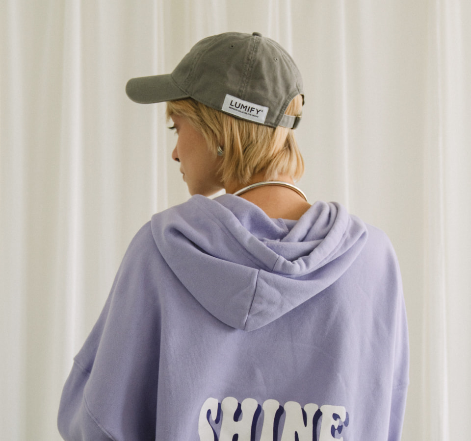 Custom Lumify branded hat and purple hoodie worn on model