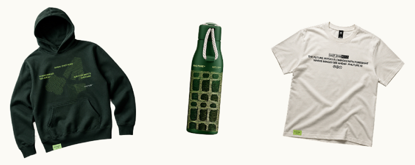Custom merchandise featuring a black graphic hoodie, ceramic mug and green keychain