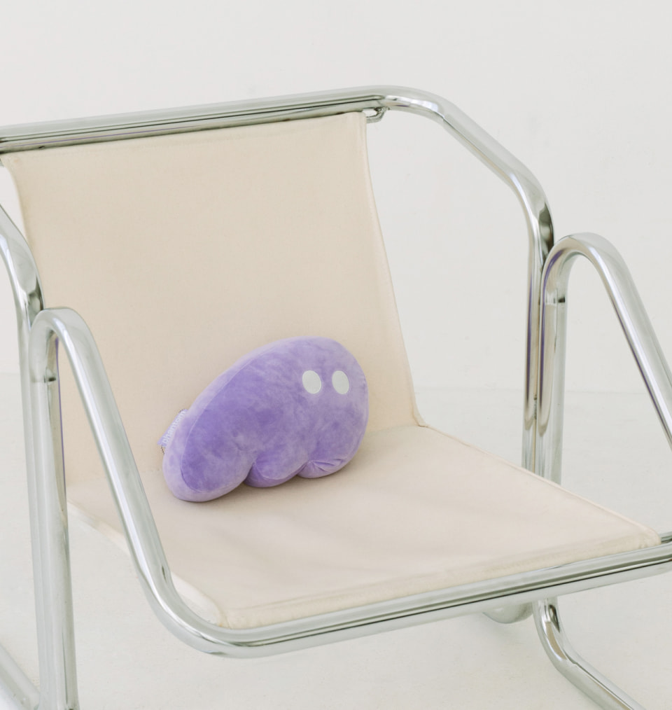 Custom stuffed Phantom purple pillow on chair
