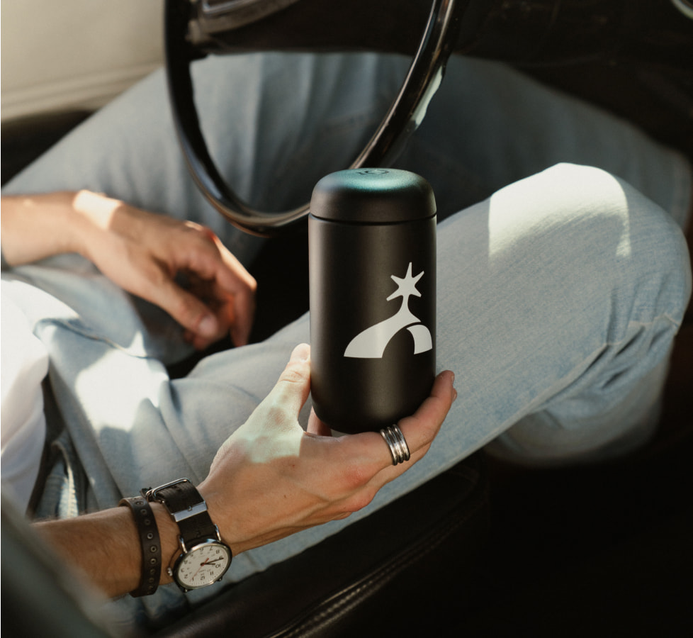 Custom branded black bottle with company emblem