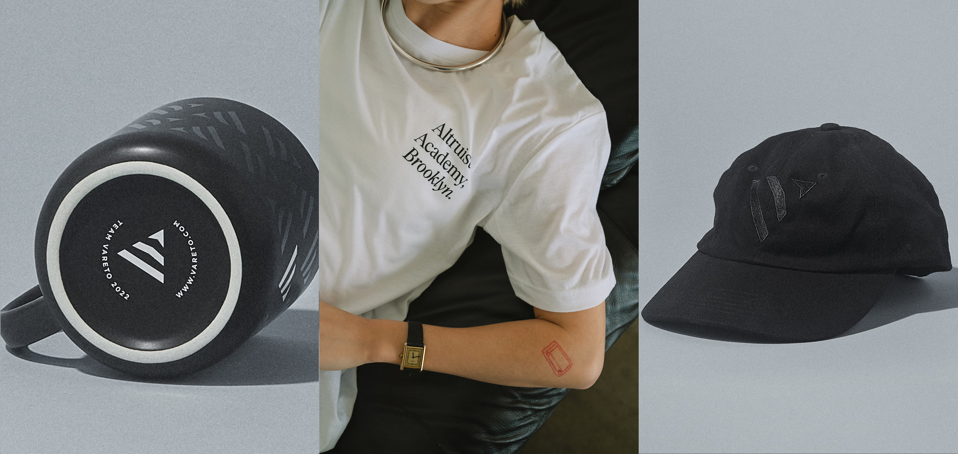 Close up shot of bottom of black mug with vareto.com in white on bottom, close up shot of model wearing white teeshirt with black branded words on front, next to custom black on black screenprinted hat