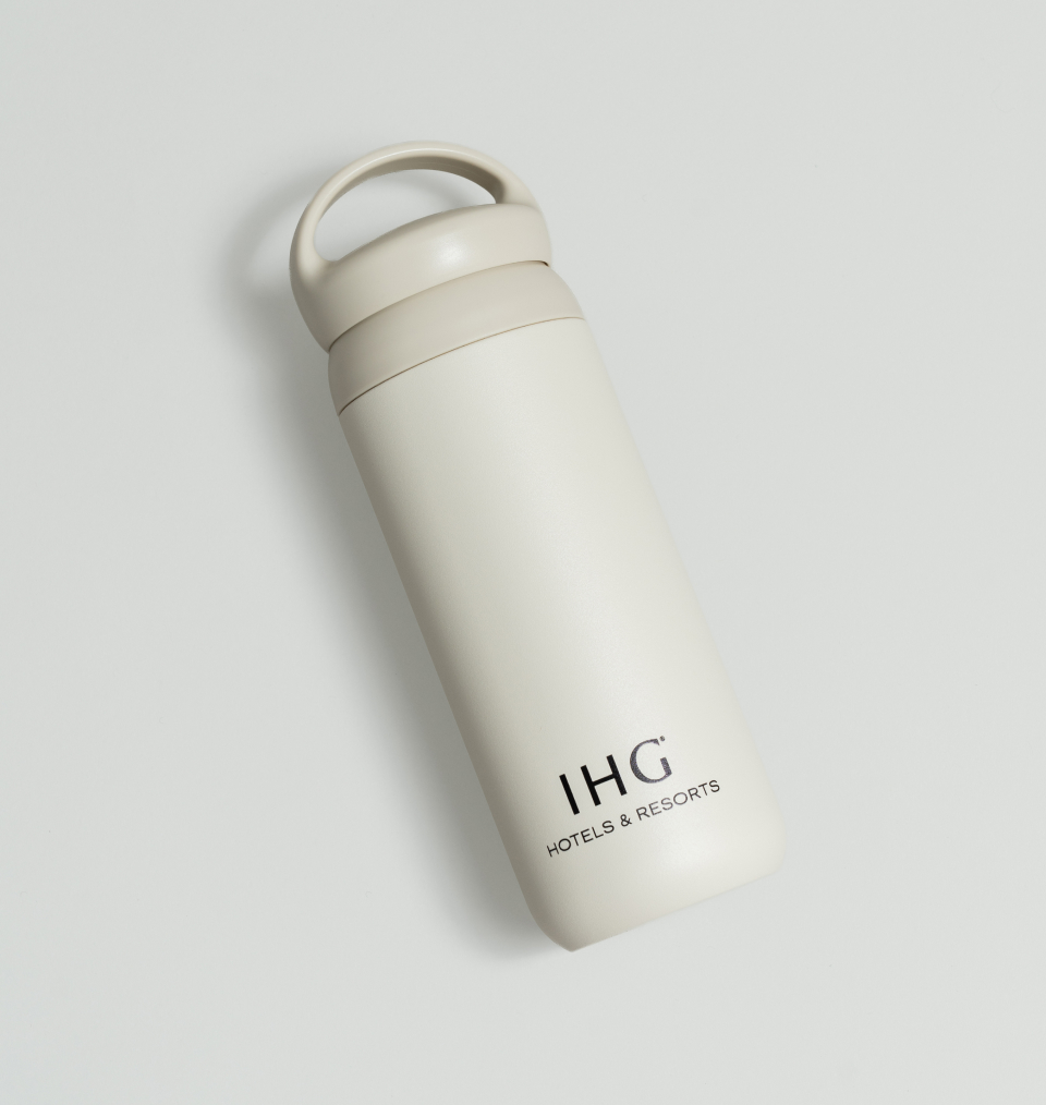 Custom IHG resorts and hotels cream tumbler with handle