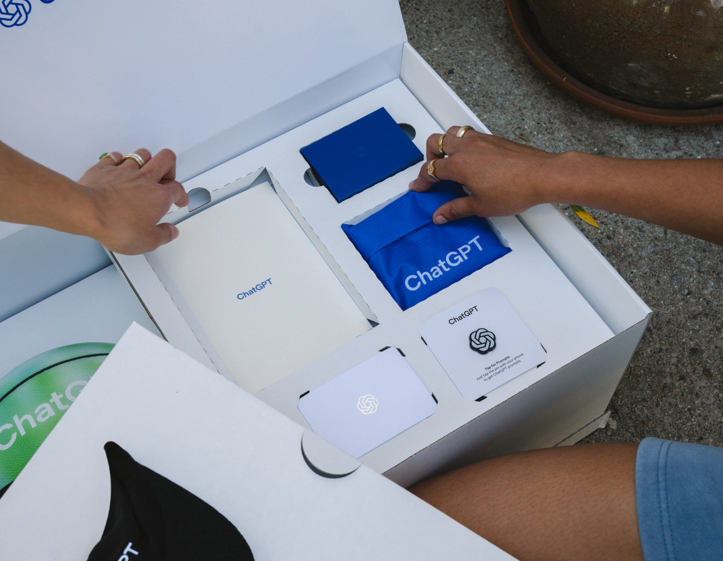 OpenAI ChatGPT custom welcome kit with branded packaging and blue accessories