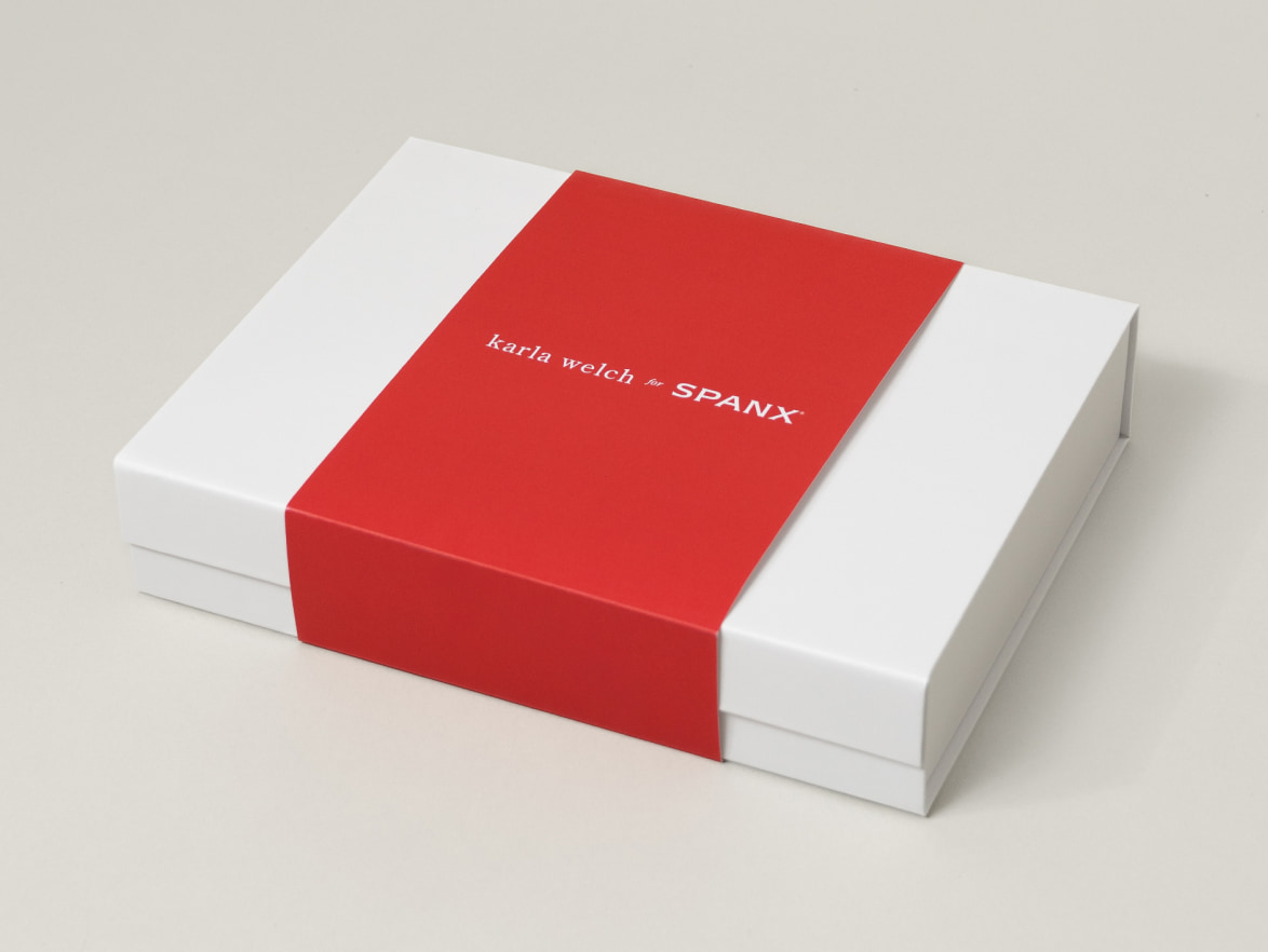 Karla Welch for SPANX custom white gift box with red branded sleeve