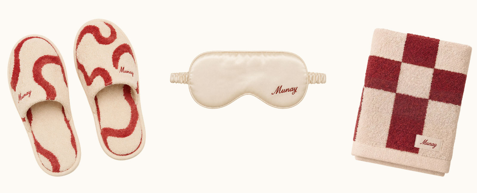 Custom red and cream branded Munay slippers, eye mask, and towel