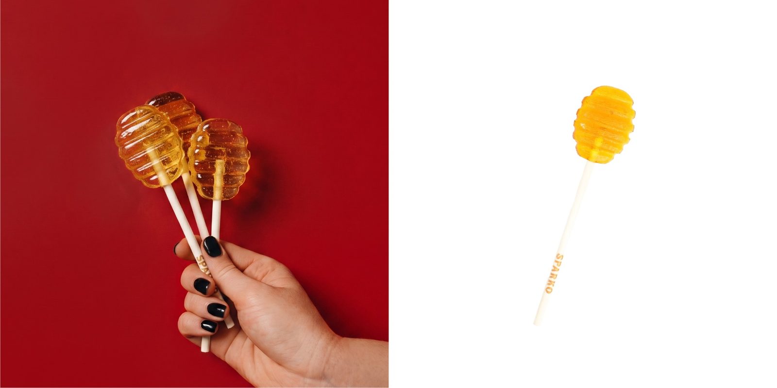 Honey lollipops held against a red background