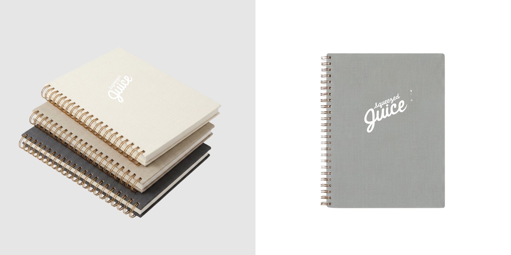 Stack of Appointed spiral notebooks beside a gray notebook customized with the Squeezed Juice logo.