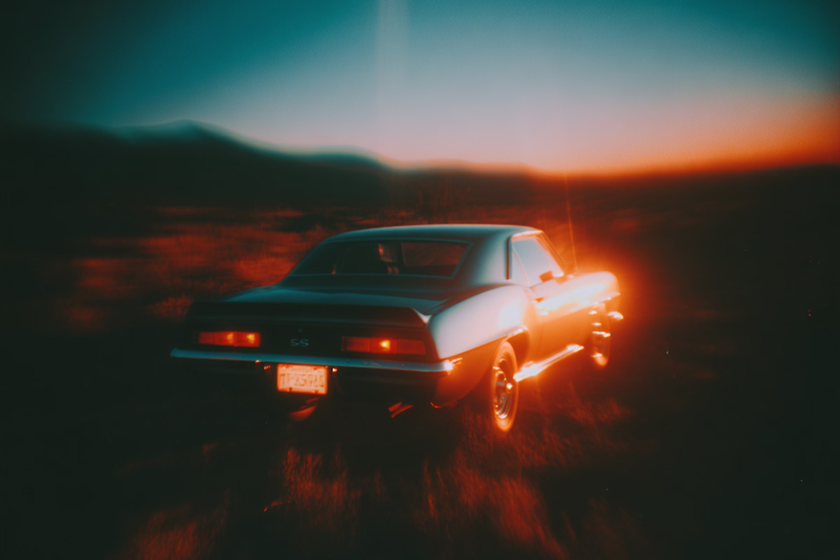 A cinematic muscle car on the sunset