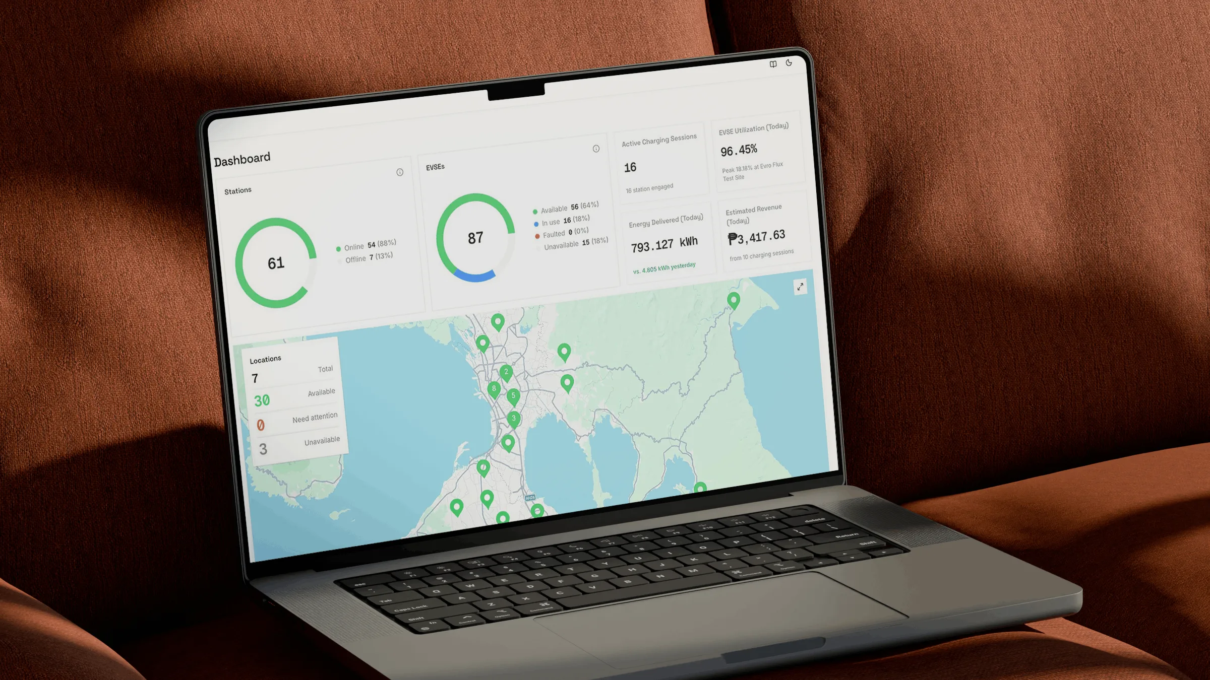 Laptop showing the Evro charging dashboard and station map.