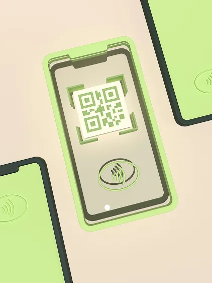 Phone scanning a QR code between contactless payment cards.