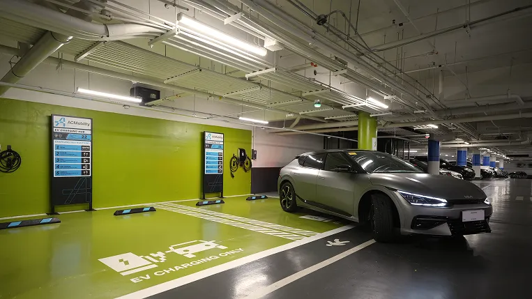 Electric vehicle parked at an indoor Evro charging bay.