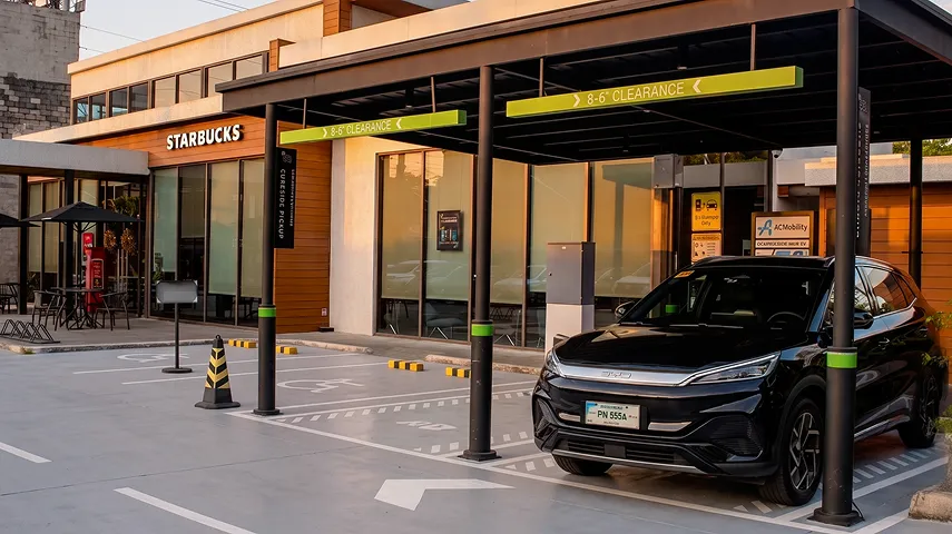 Electric vehicle charging outside a Starbucks.