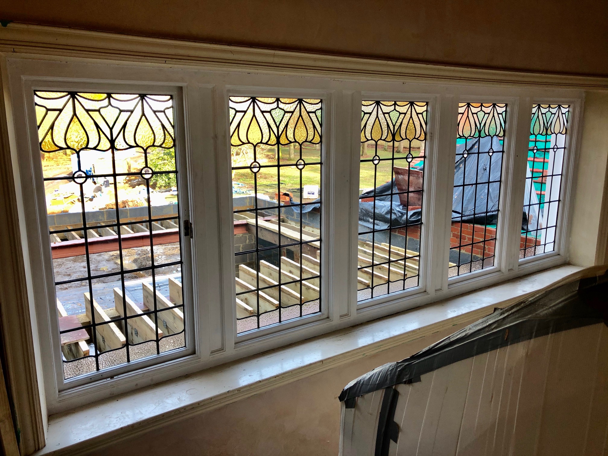 Leaded light windows from a stairwell in Brokenhurst.