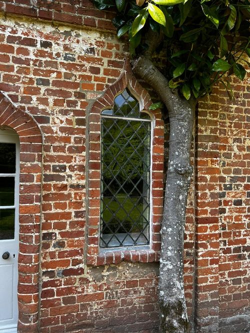 testing Exterior view of leaded glass and metal window frames in Hampshire.