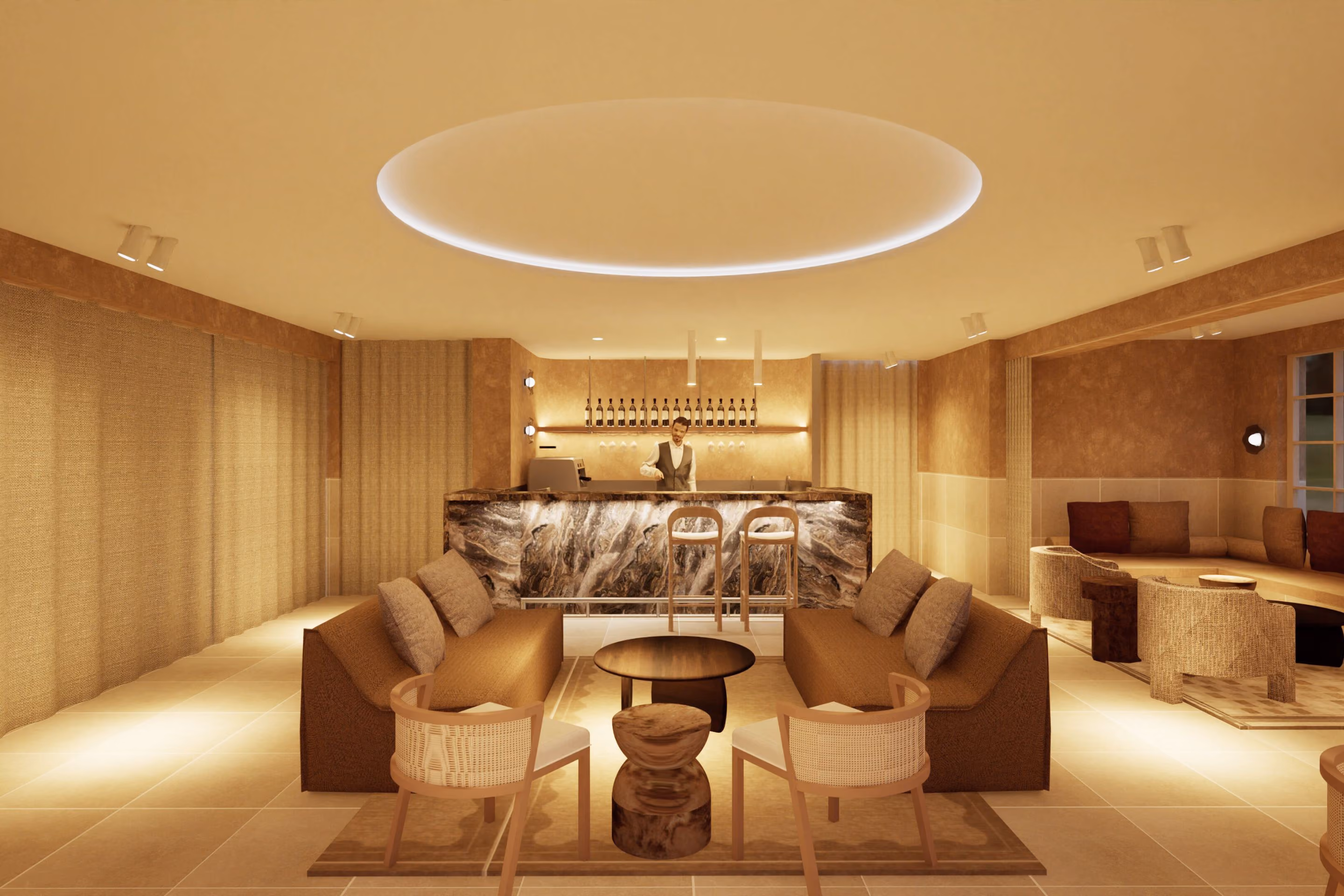 The relaxation lounge at VELA, with armchairs beneath a circular light