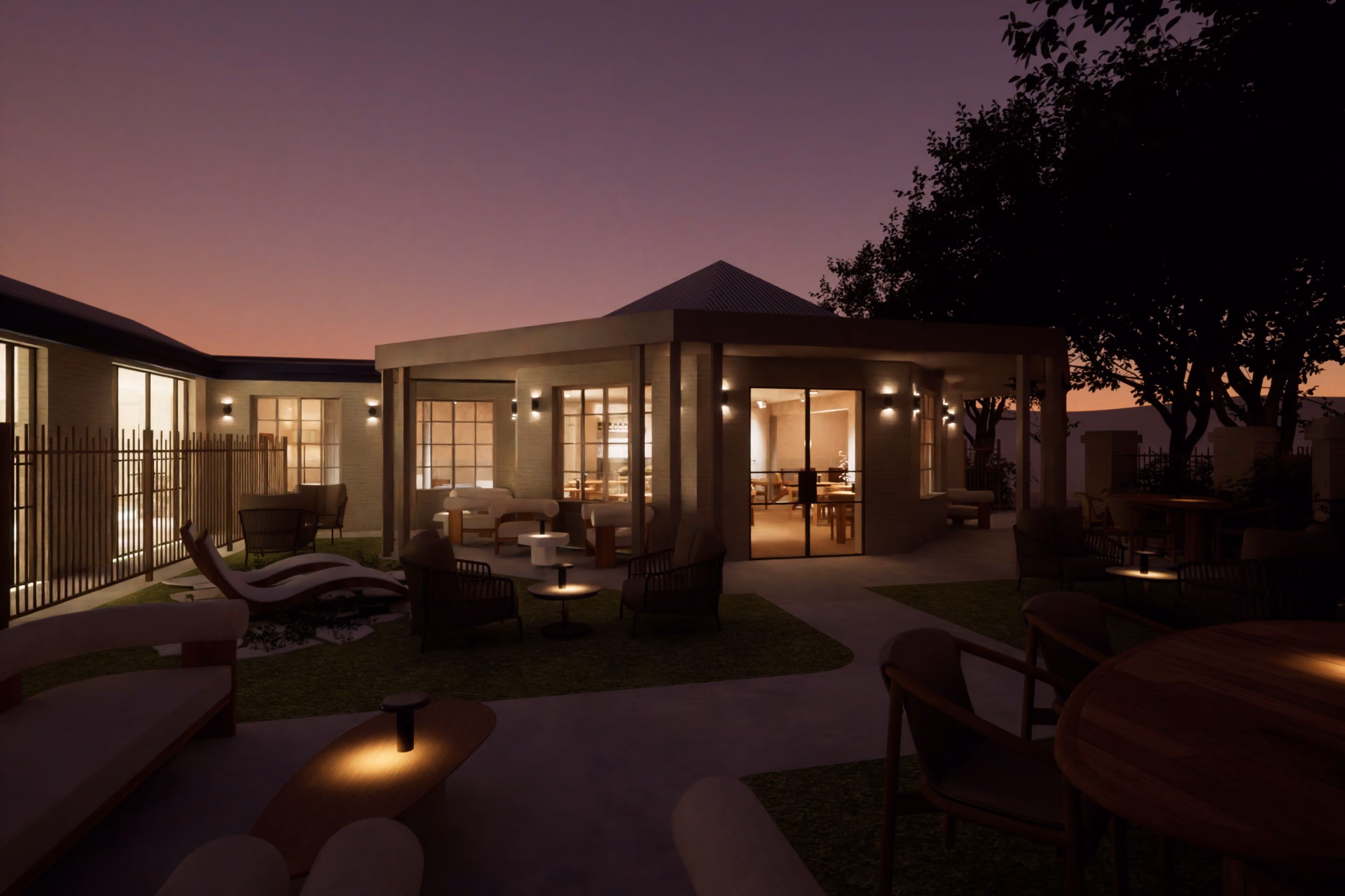 VELA Spa & Bathhouse at dusk, seen across the outdoor pool