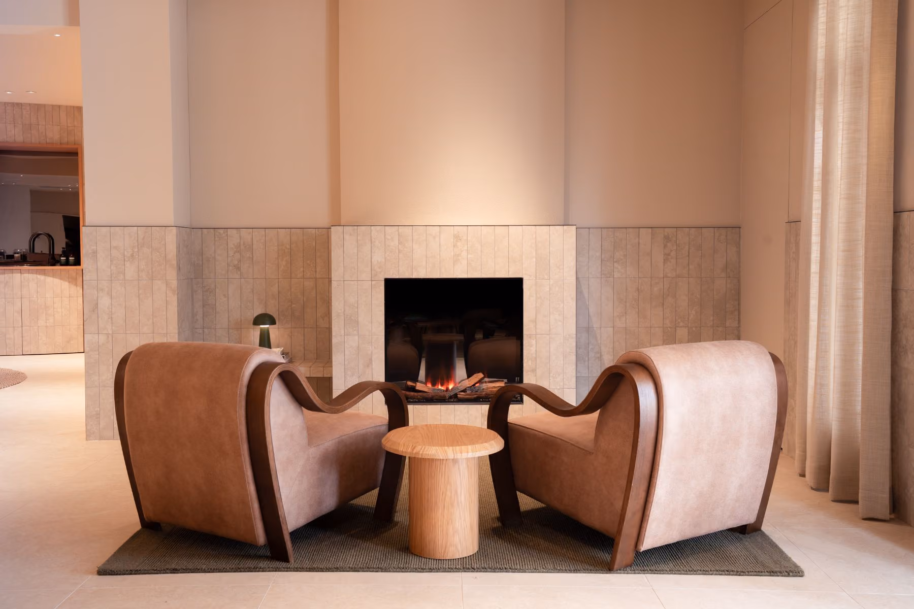 The VELA dining room, with banquette seating and a curved light feature