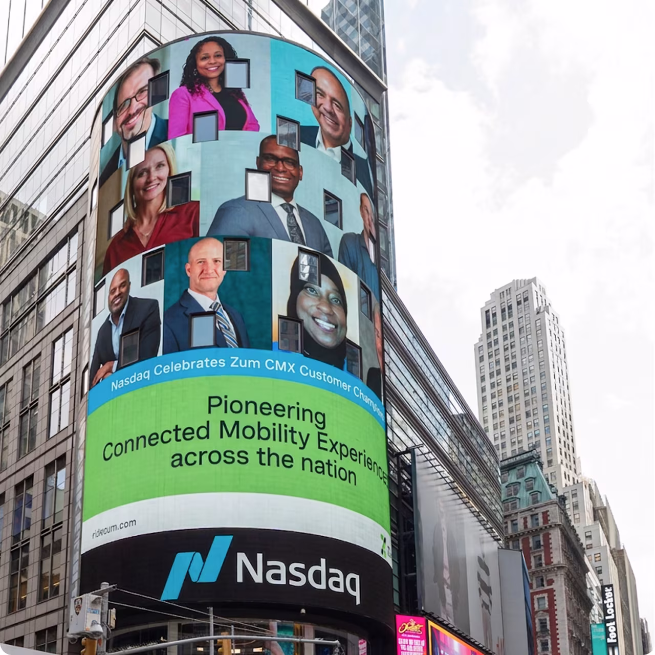 Billboard displaying Nasdaq celebrating Zum CMX with various professional headshots on a city