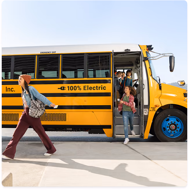 Students disembarking bus at school