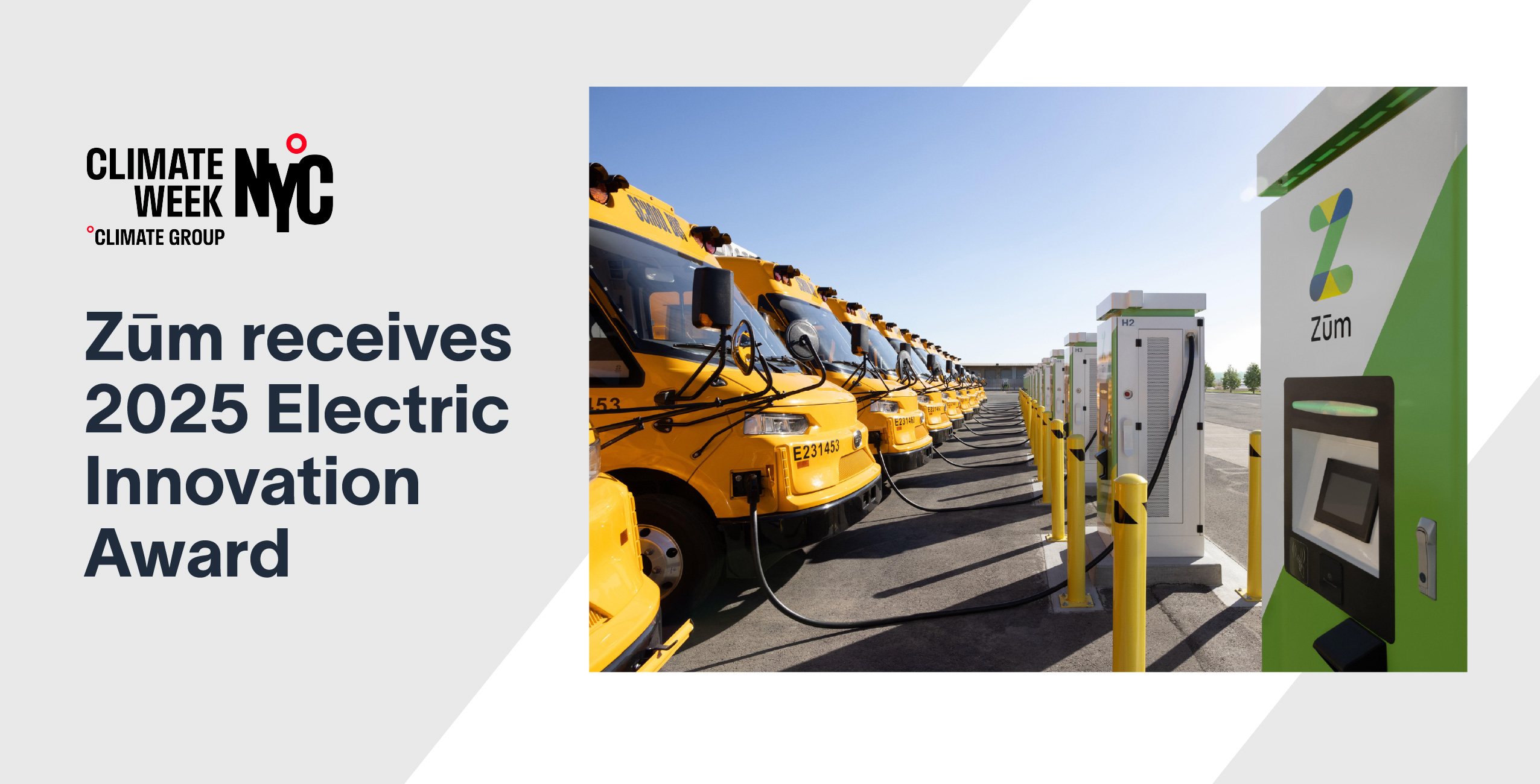 Yellow school buses lined up alongside EV charging stations at a transportation facility.