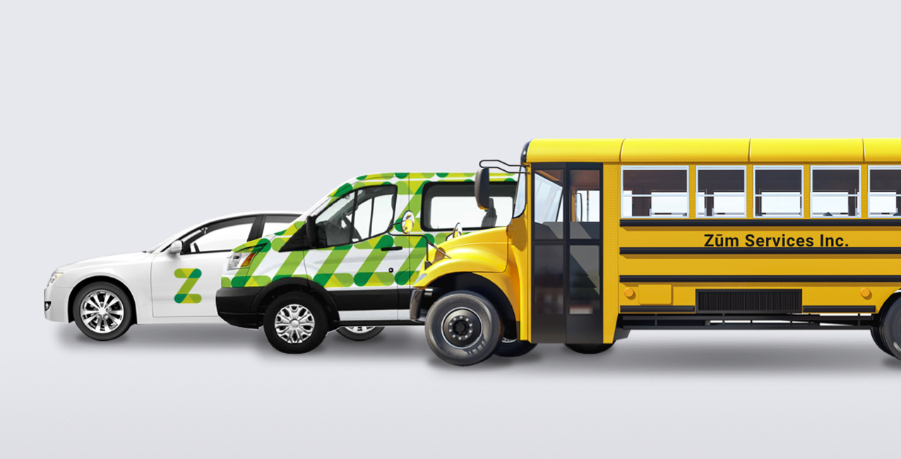 Three vehicles in a row: a white car, a green-accented van, and a yellow school bus.