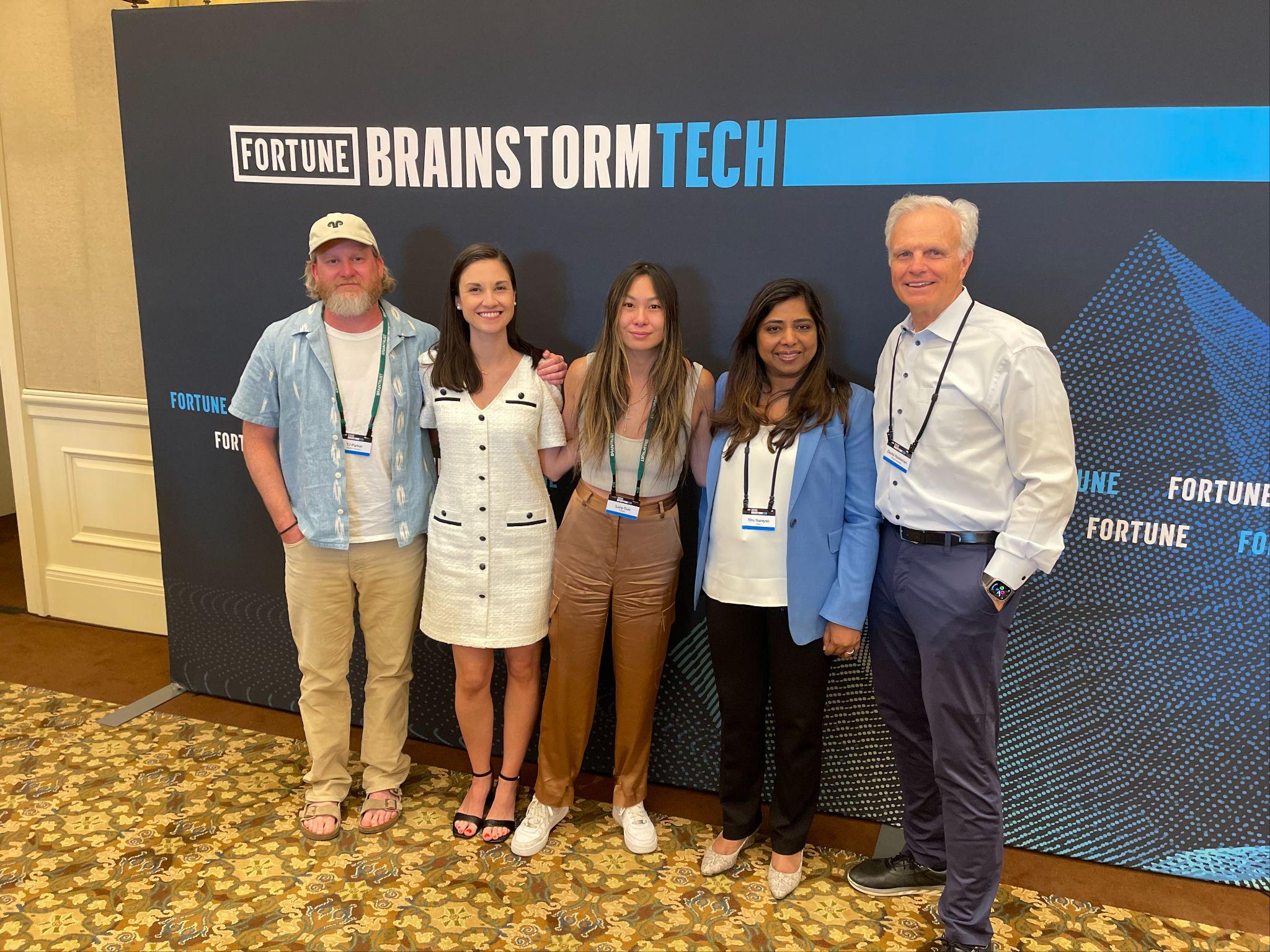 Group at Fortune Brainstorm Tech: 5 people, including panelists and industry leaders, smiling