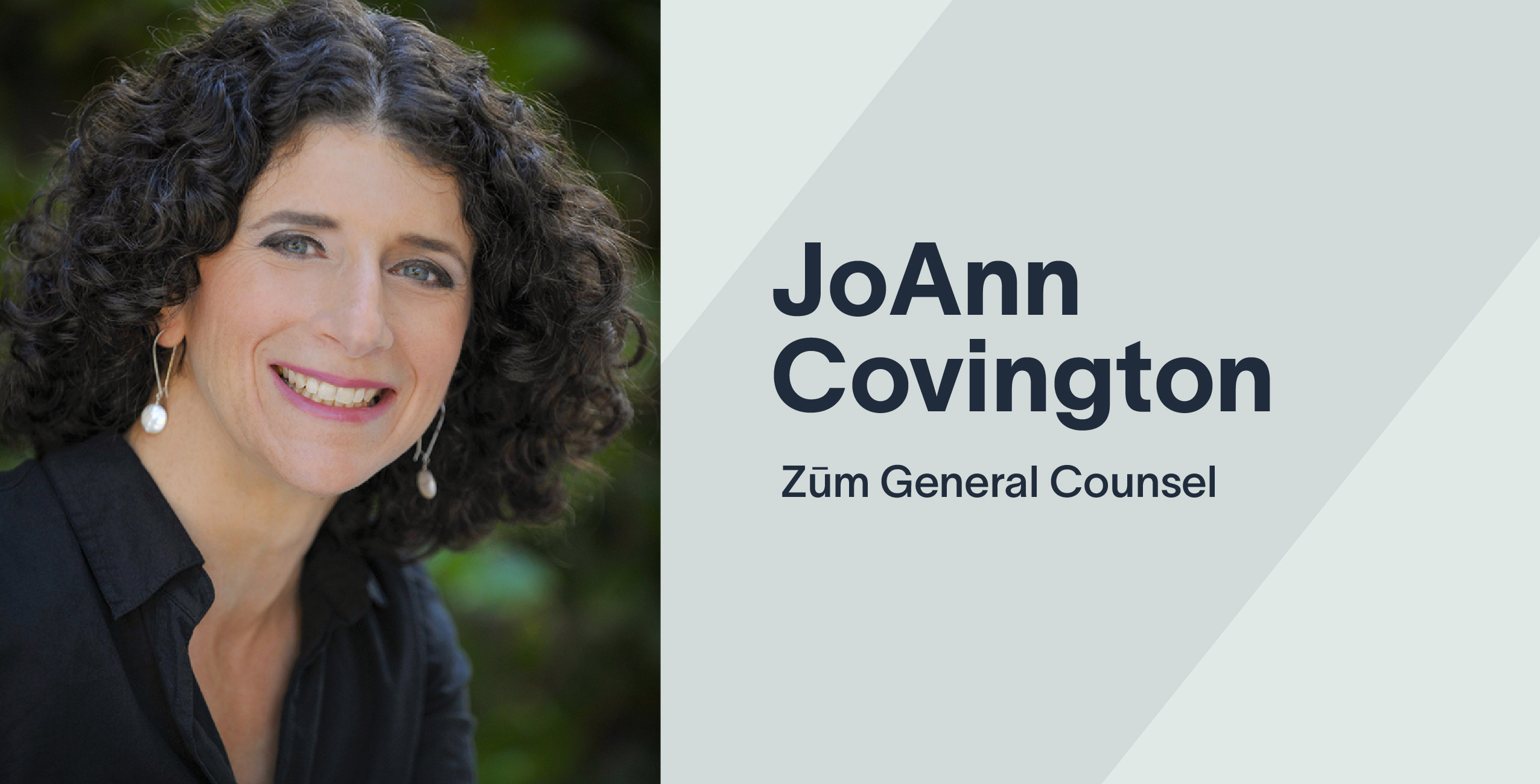 JoAnn Covington, Zum General Counsel, smiling with curly hair against a blurred green background.