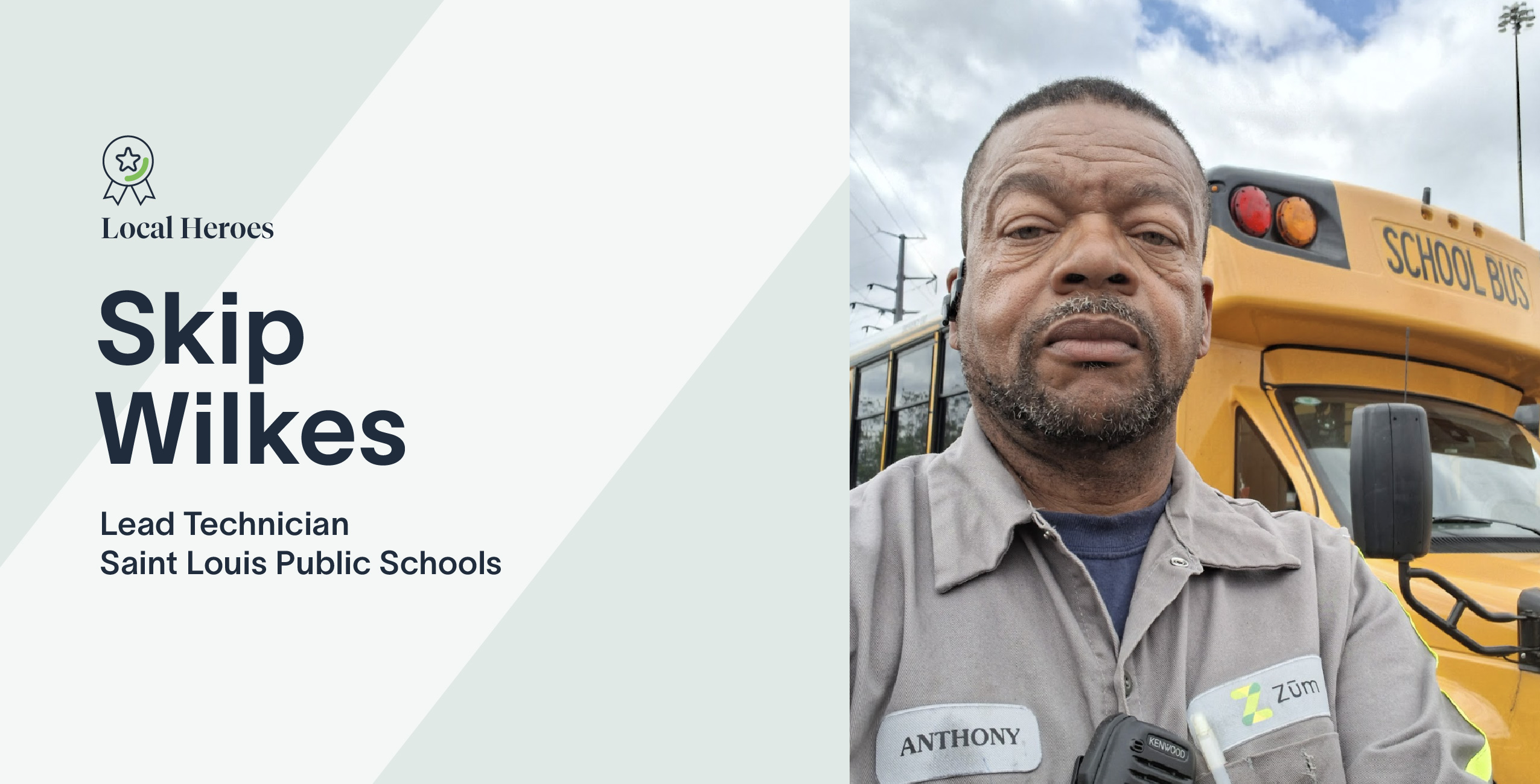 Skip Wilkes, Lead Technician at Zum, stands in front of a school bus in St. Louis.