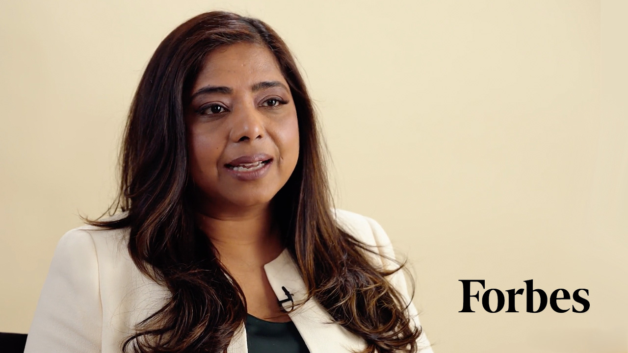 An interview with a woman speaking, with the Forbes logo displayed in the corner.