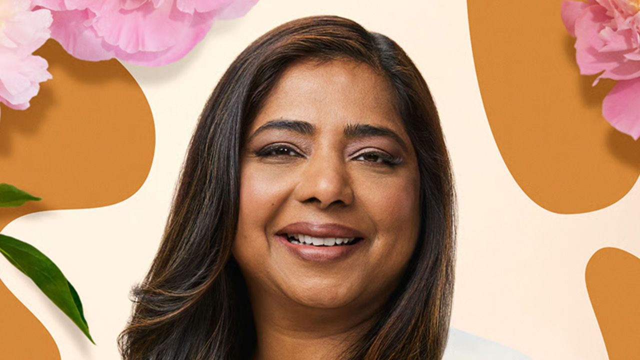 Headshot of a woman smiling, surrounded by pink flowers and abstract shapes.