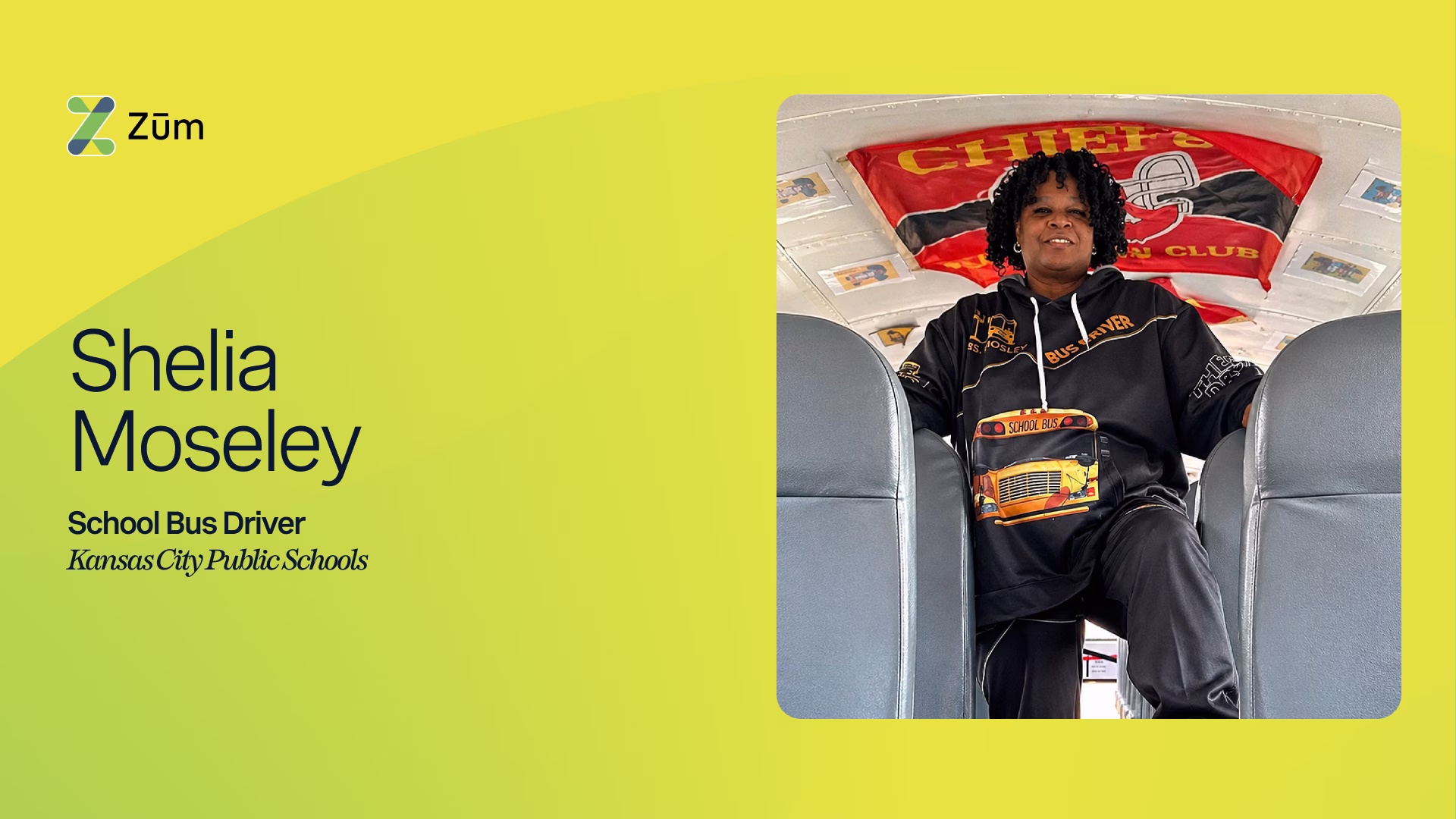Shelia Moseley, a Kansas City school bus driver, sits in a bus with Chiefs flag behind her.