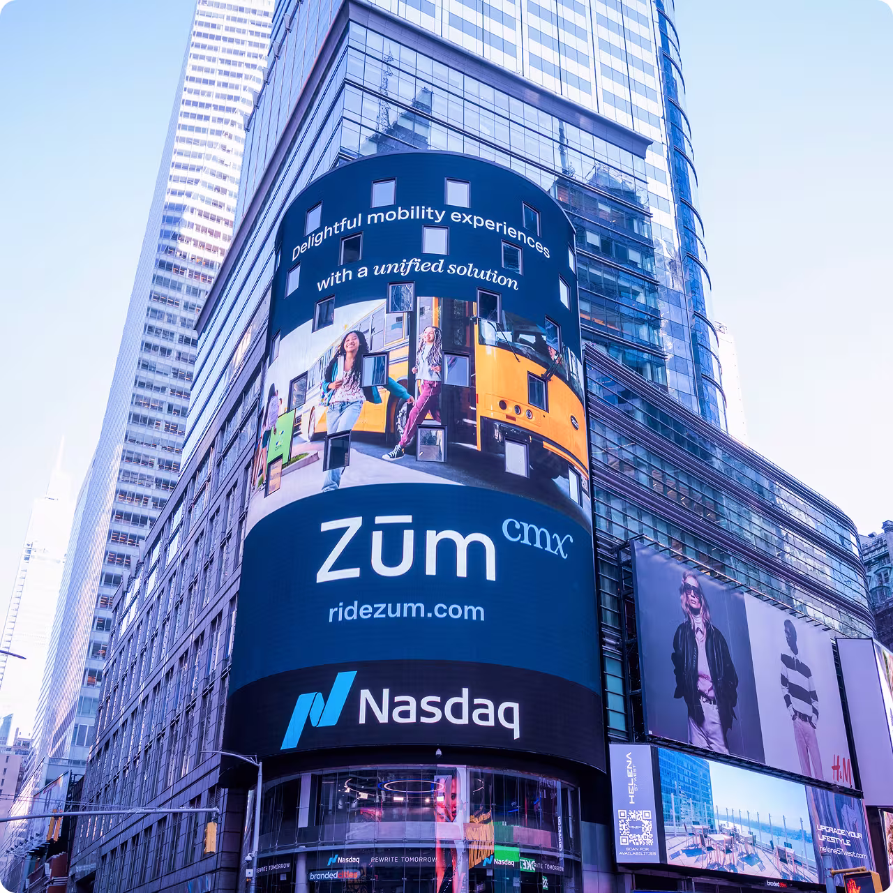 Billboard in NYC advertising Zum CMX with text about unified mobility solutions and Nasdaq logo.