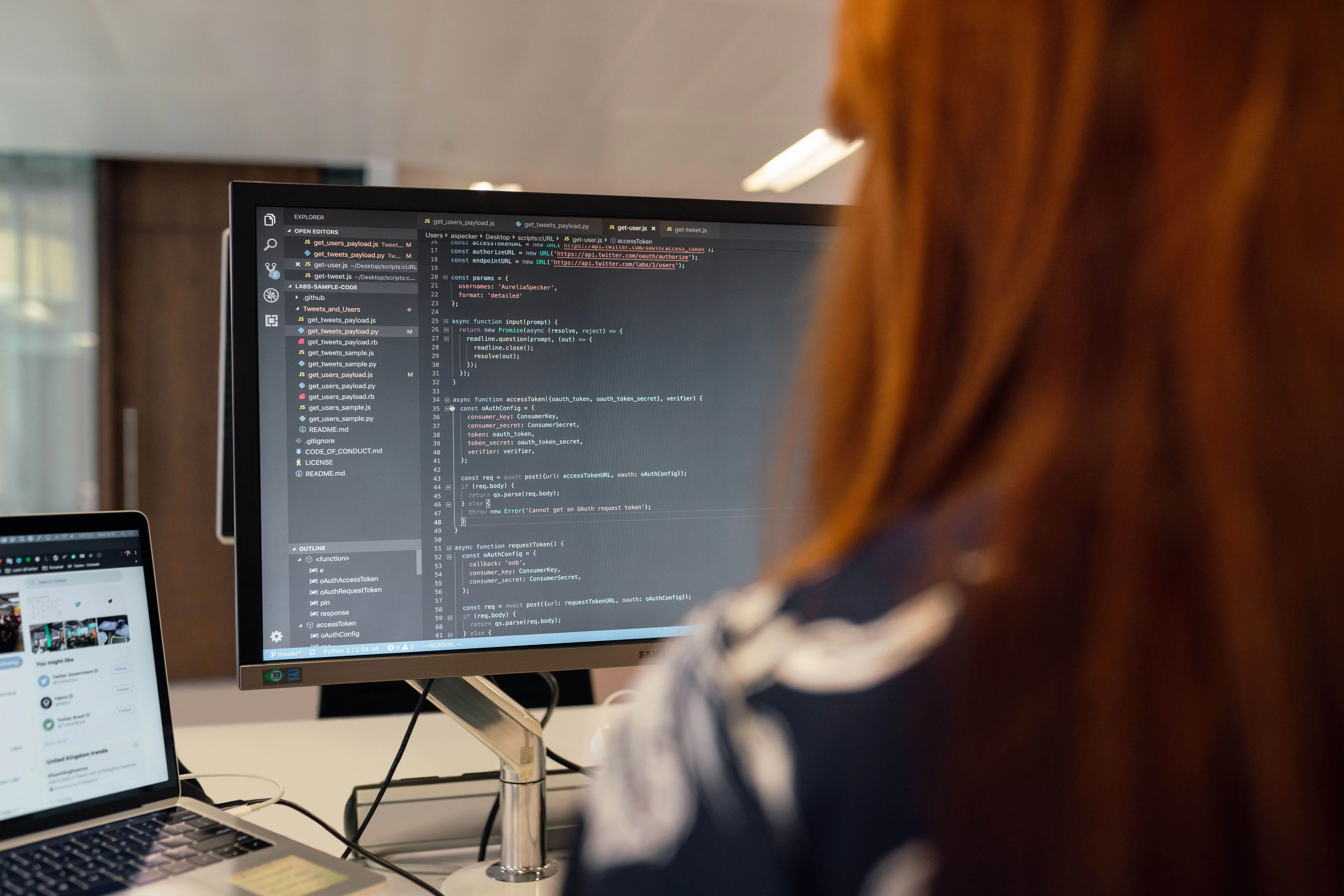 A software developer working on secure, scalable code within a modern office, representing the technical rigor required to maintain medical IT infrastructure.