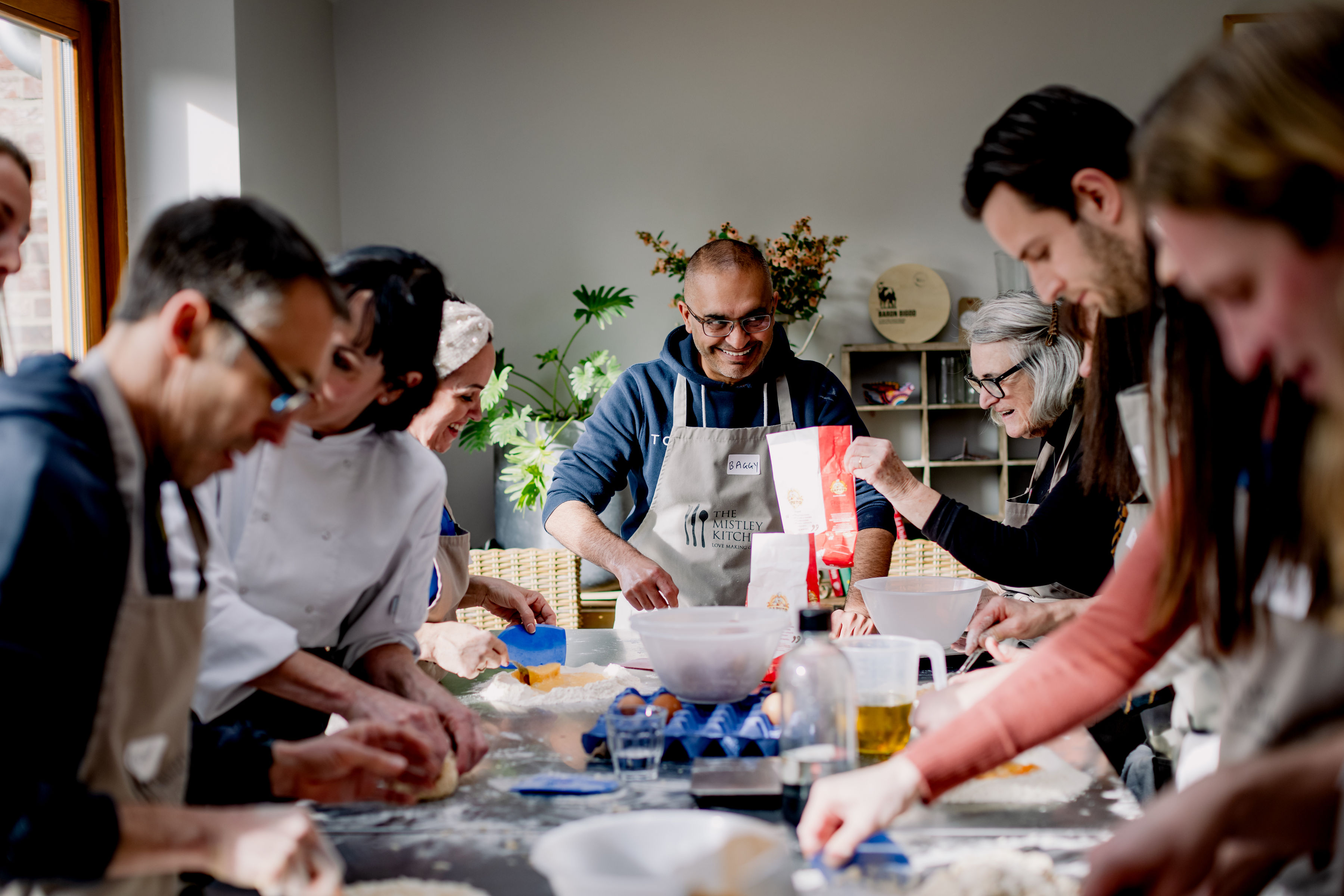 A group of people taking part in a cooking class.