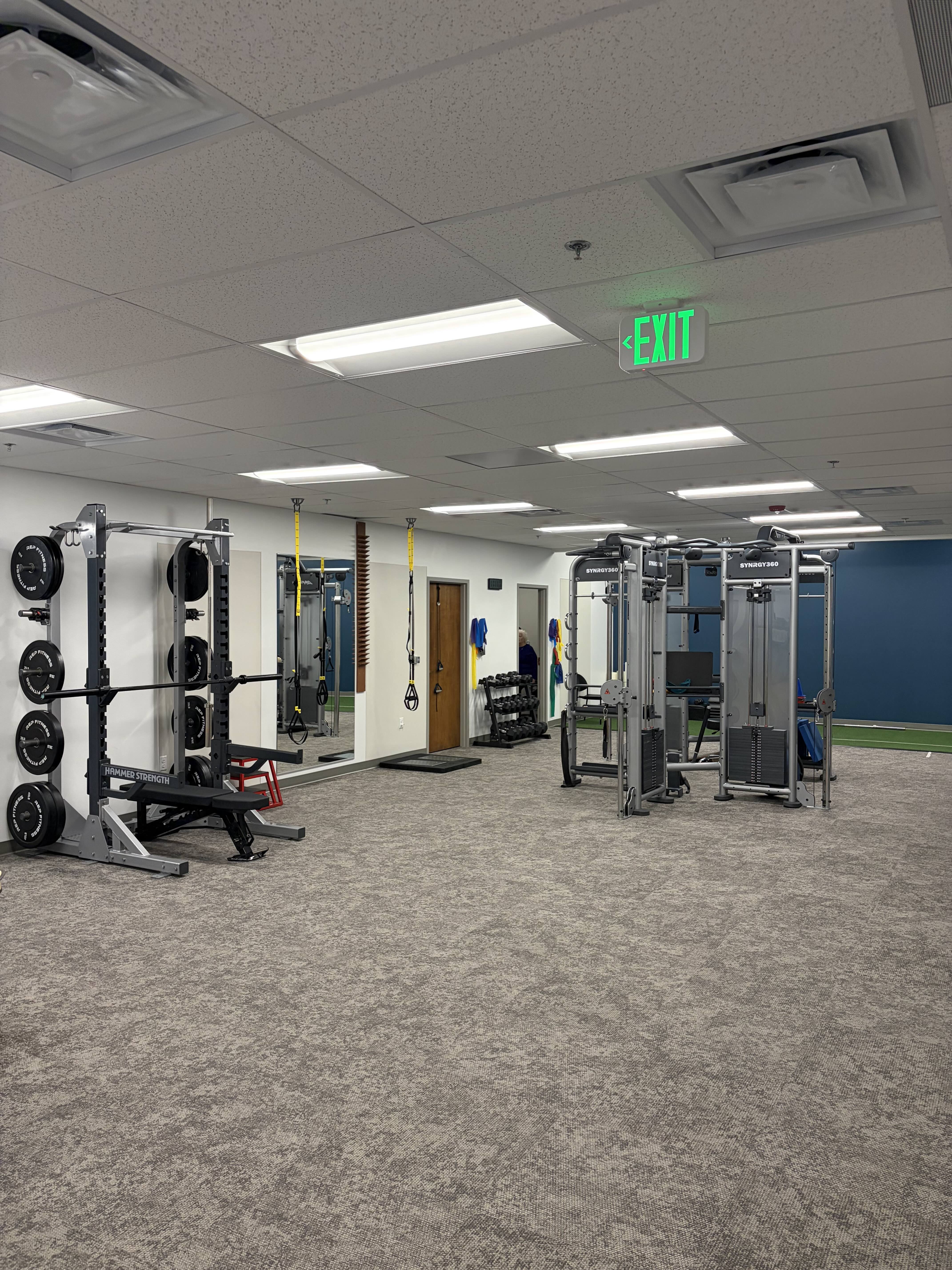 Peak training floor with squat rack and equipment