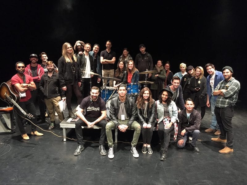 Capitola Media cast and crew gathered on a studio production set