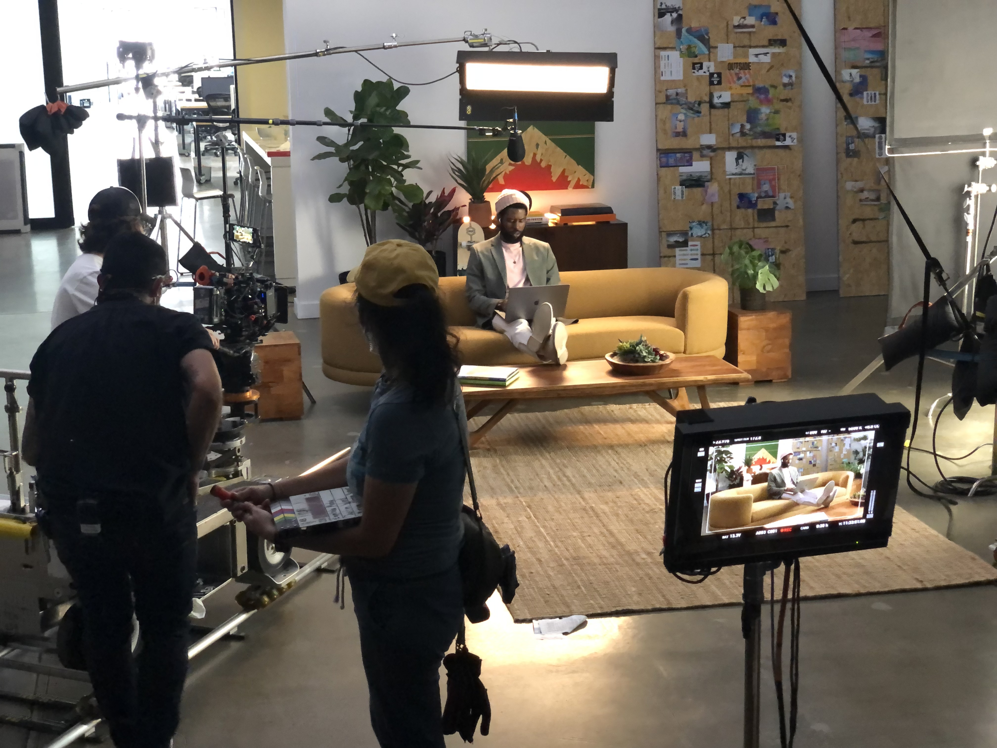 Two production monitors displaying a color-striped clapperboard before a take.