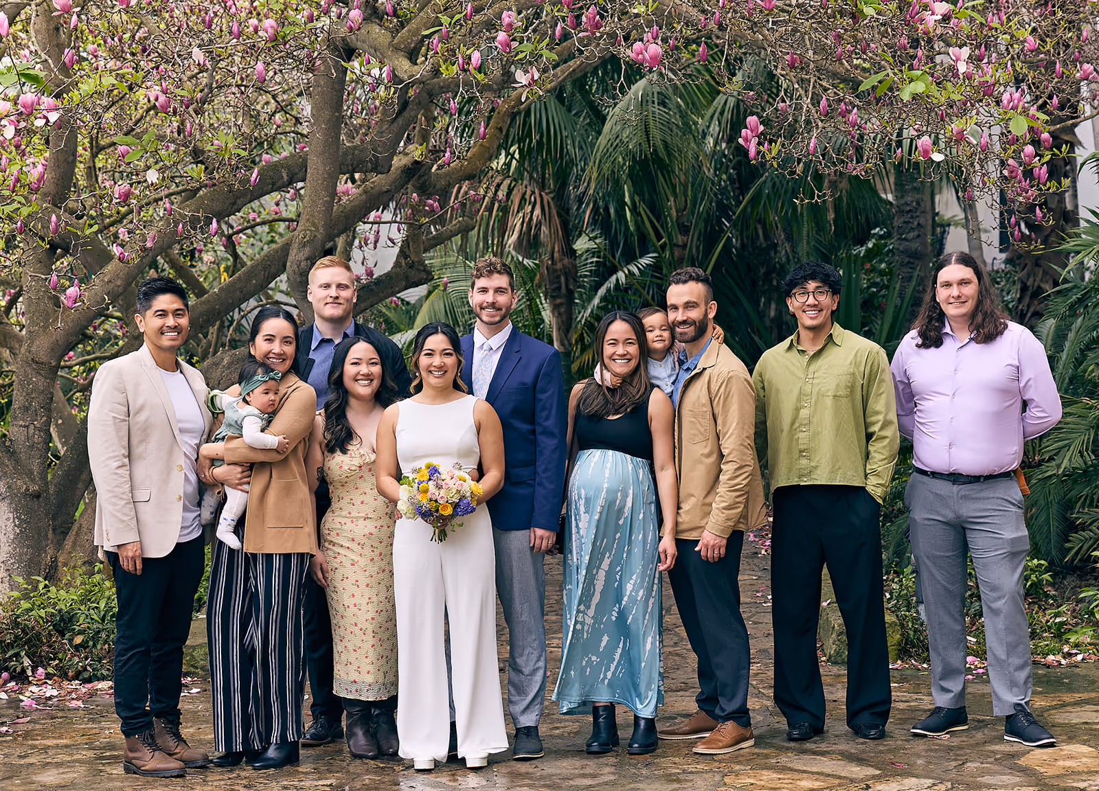 Family photo for young wedding couple with baby