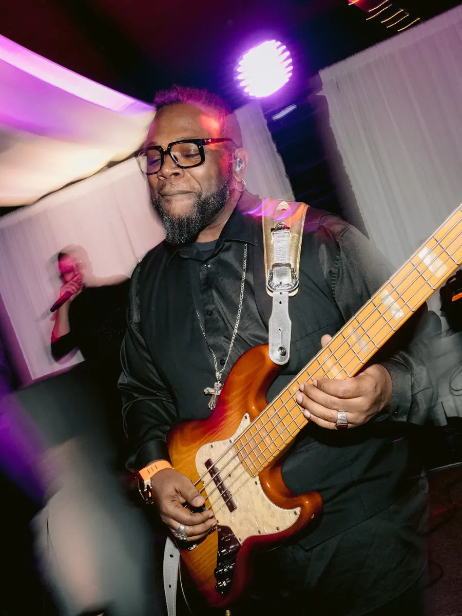 DME AllStars bass guitarist performing live