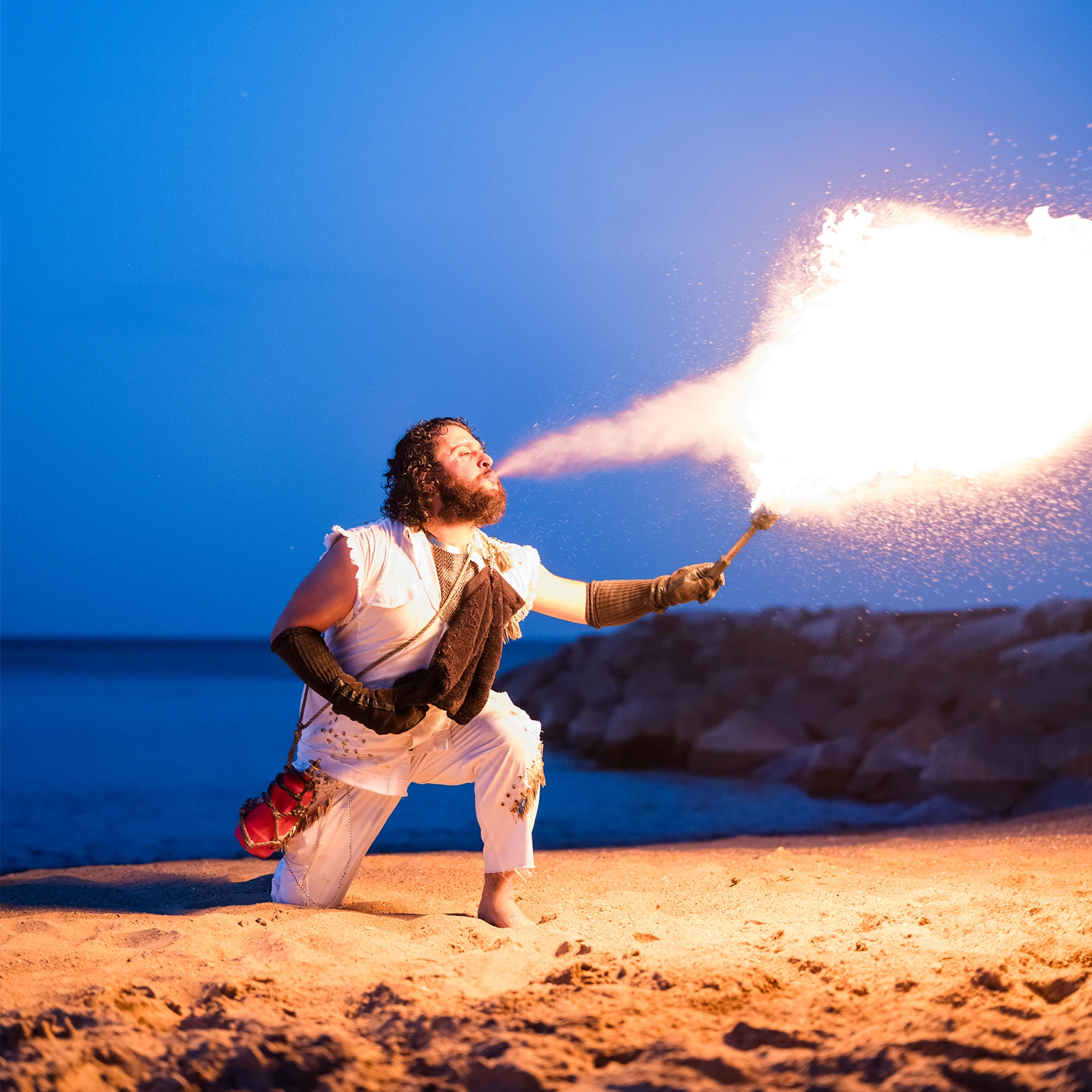A firebreather on the beach