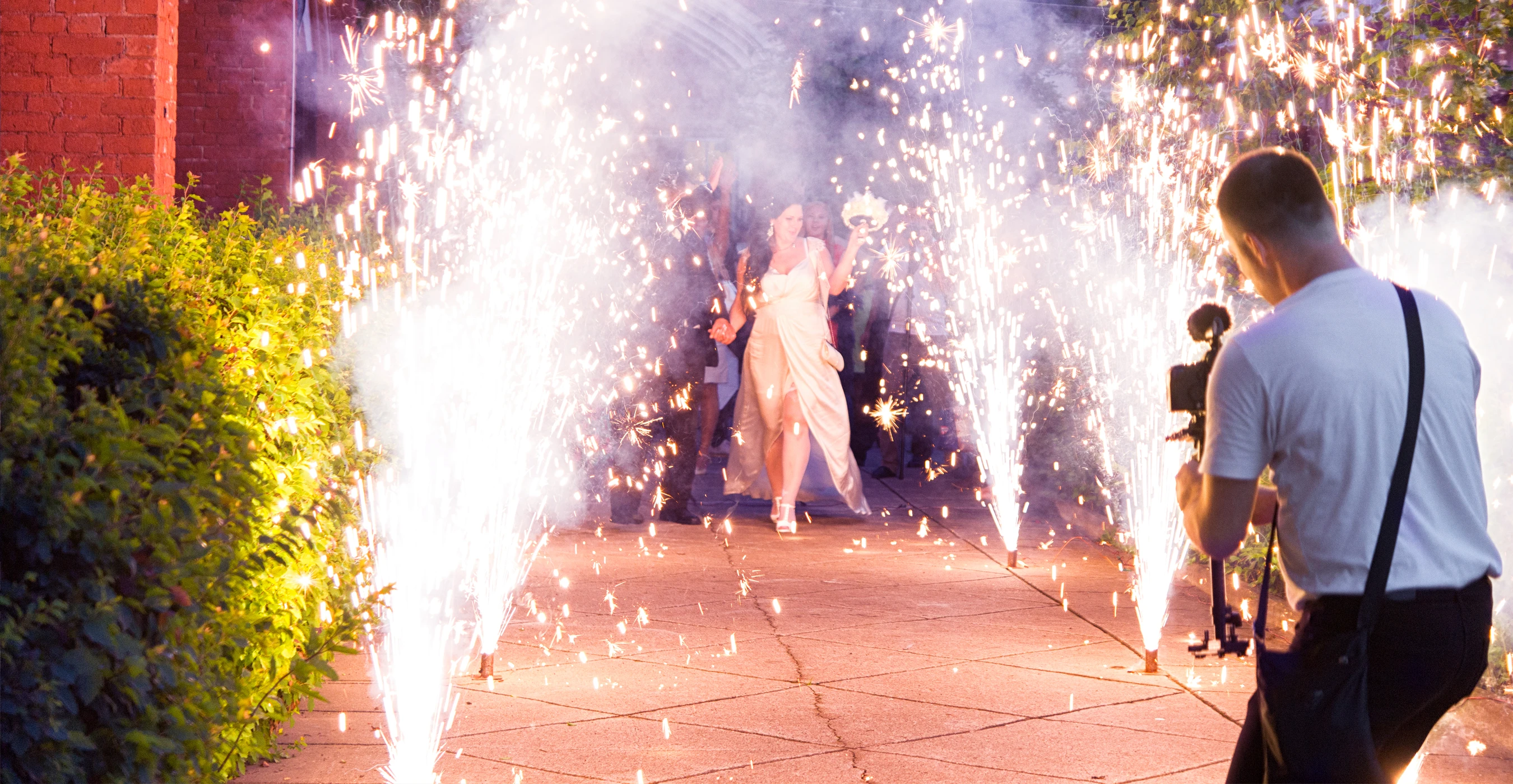 photo of a videographer at a wedding