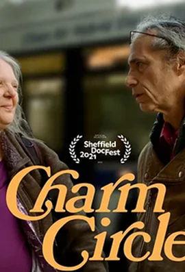 Close-up of an older woman and man facing each other outdoors, with Charm Circle text overlay.