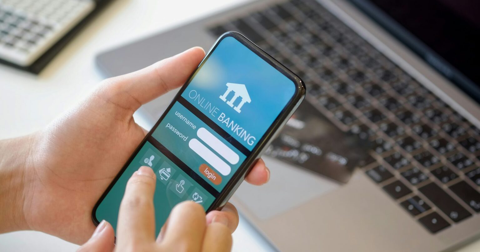 Person entering personal info on banking app on a smartphone