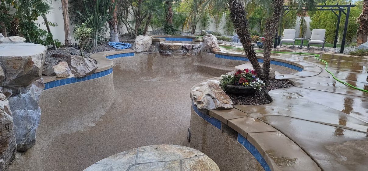 Pool remodel with a rock waterfall feature