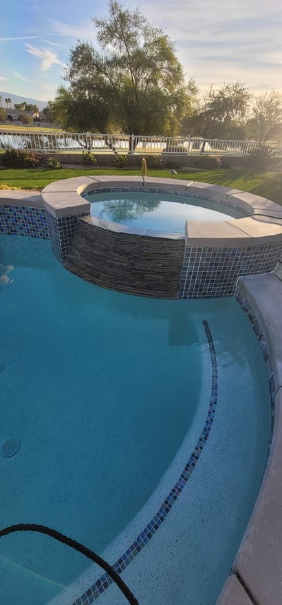 Pool with a raised spa and tiled edge