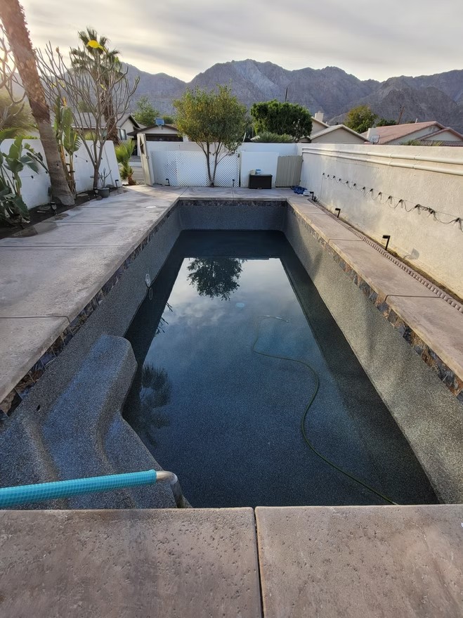 Pool resurfaced with dark plaster in La Quinta