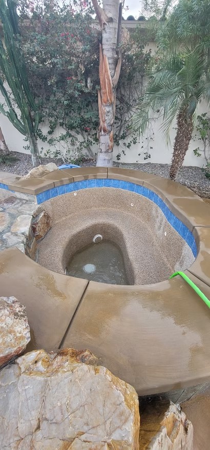 Round spa with blue waterline tile
