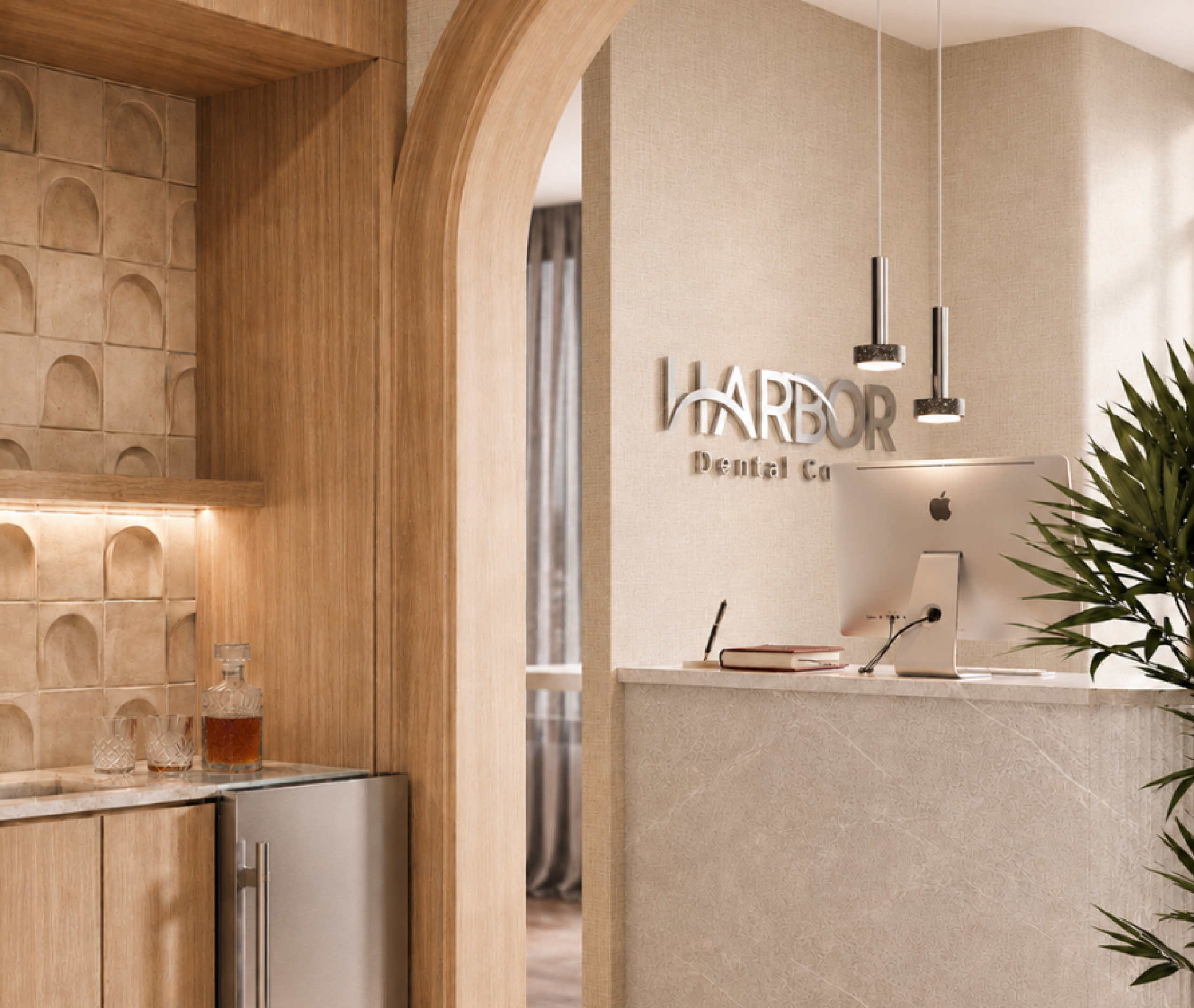 Reception desk with computer and sign reading Harbor Dental Co in a modern office with wood and marble accents.
