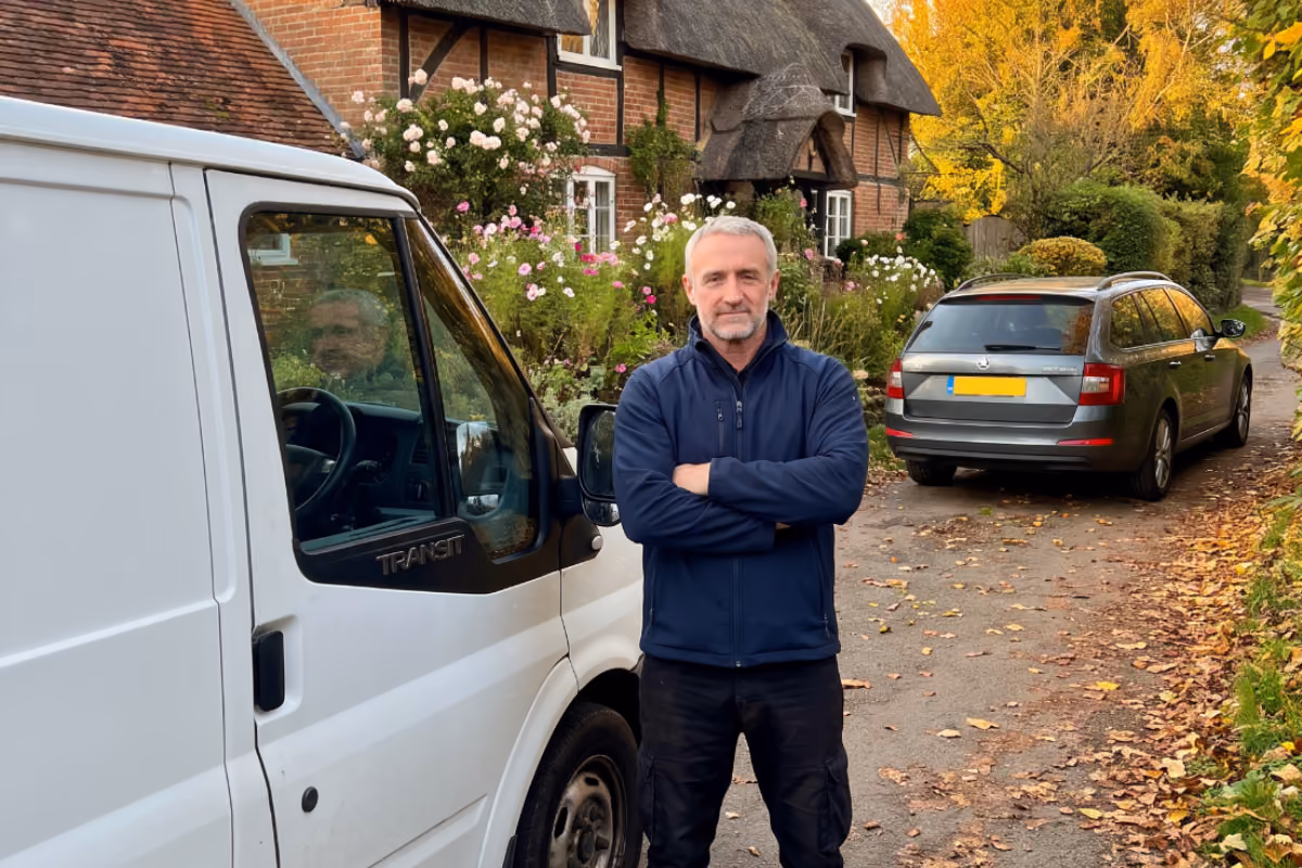 Maxamy Mobile Autocare mechanic standing beside his mobile service van at a customer location.