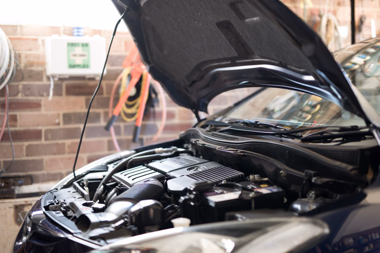 Car with its bonnet open, ready for mobile car repairs at the customer's home